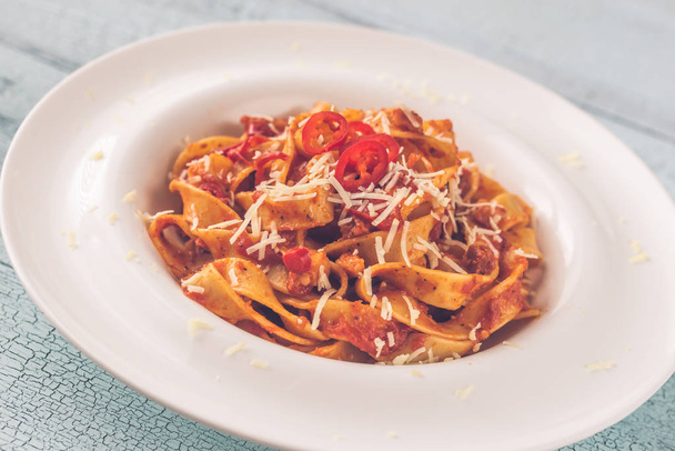 Portion of tagliatelle pasta with amatriciana sauce - Photo, Image