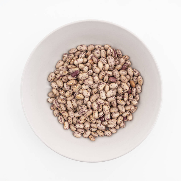 A plate of dried Pinto beans - Photo, Image