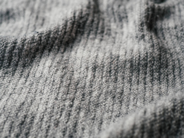 Gray sweater fabric texture. Clothes sweater background with folds - Foto, imagen