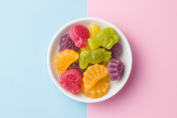 Fruit jelly candies in bowl on colorful background. - Φωτογραφία, εικόνα