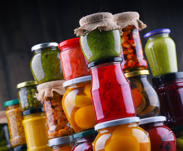 Jars with variety of pickled vegetables and fruits - Foto, Imagen