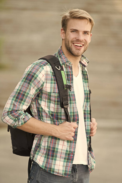 Education boost successful future. Man regular student appearance. College education. College life. Modern student. College student with backpack urban background. Handsome guy study in university - Zdjęcie, obraz