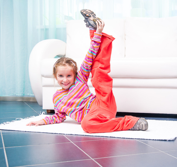little girl playing sports at home - Foto, imagen