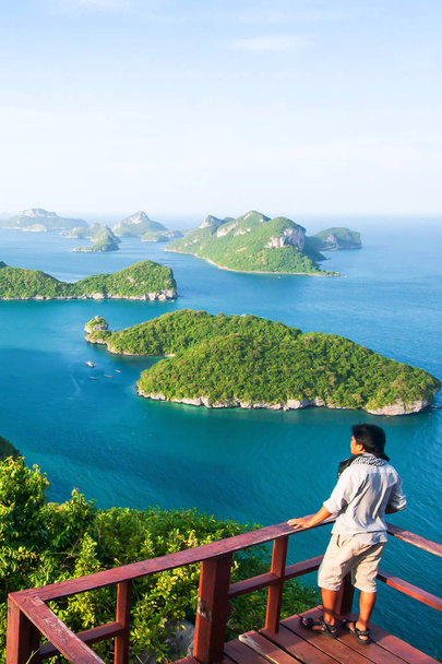 Young man on viewpoint at the top of Koh Wua Ta Lap. - Photo, Image