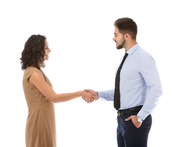 Portrait of young business people shaking hands on white background - Photo, Image