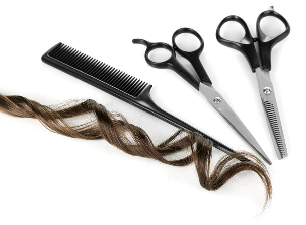 Shiny brown curl with scissors and comb isolated on white - Valokuva, kuva