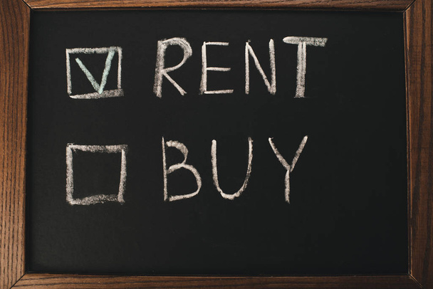 top view of chalkboard with rent and buy lettering  - Photo, Image