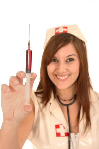 Beautiful Nurse Holding Syringe - Foto, afbeelding