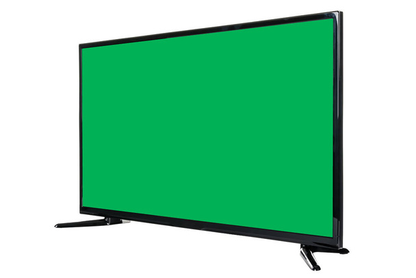 現代の高精細テレビ。抽象的なぼやけた白い背景に隔離された、空白の緑色のクロマキー画面を持つ液晶フラットモニター。技術と4kテレビの広告コンセプト。詳細なスタジオクローズアップ - 写真・画像