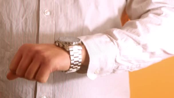 Close up man in shirt look at watch. Check up time. Business man waiting for partners - Video, Çekim