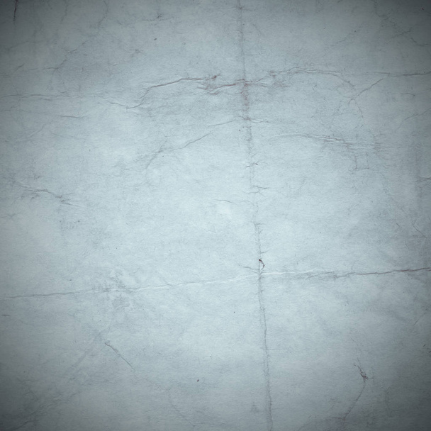 Old background with dust and dirty stains. Blank aged paper sheet. Vintage and antique art concept. Texture like cardboard, stone, concrete or natural marble - Φωτογραφία, εικόνα