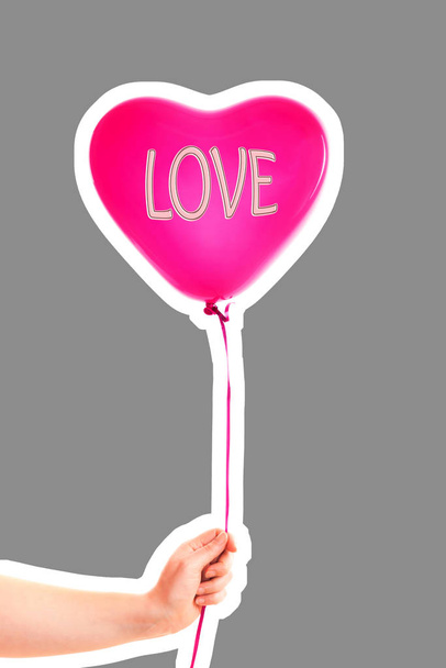 Female hand holds red rubber inflatable heart shape balloon. Love, relationship, valentines day and birthday celebration concept. Magazine style fashion collage with blank copy space - Foto, Imagem