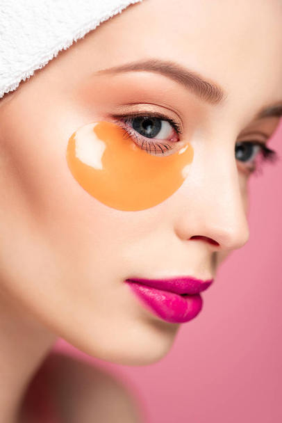 close up of young woman with eye patch isolated on pink  - Foto, Imagen
