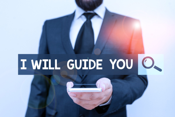 Writing note showing I Will Guide You. Business photo showcasing Help showing a route Influence to do or think something Male human wear formal work suit hold smartphone using hand. - Photo, Image