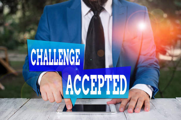 Word writing text Challenge Accepted. Business photo showcasing to participate or undertake in a competitive situation Businessman in blue suite with a tie holds lap top in hands - Photo, Image
