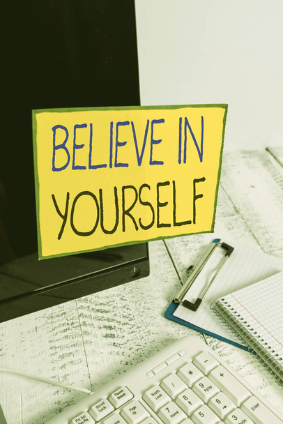 Word writing text Believe In Yourself. Business photo showcasing common piece of advice that you can do everything Note paper taped to black computer screen near keyboard and stationary - Foto, imagen