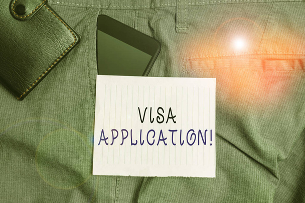 Conceptual hand writing showing Visa Application. Concept meaning Form to ask permission travel or live in another country Smartphone device inside trousers front pocket with wallet - Photo, Image
