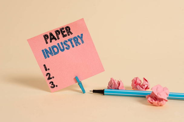 Text sign showing Paper Industry. Business photo showcasing industry of analysisufacturing and selling cellulosebased product Plain note paper and stationary placed above soft pastel colour backdrop - Foto, imagen