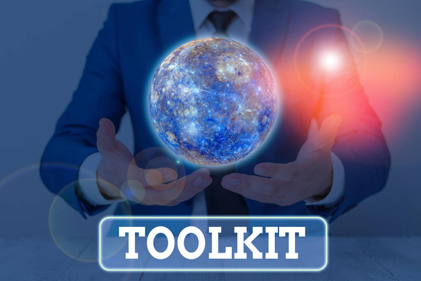 Text sign showing Toolkit. Business photo showcasing set of tools kept in a bag or box and used for a particular purpose Elements of this image furnished by NASA - Photo, Image