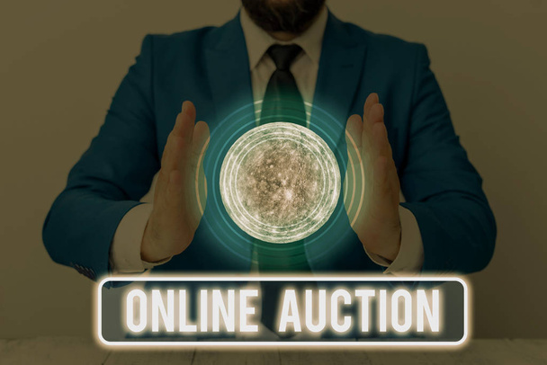 Text sign showing Online Auction. Business photo text process of buying and selling goods or services online Elements of this image furnished by NASA - Fotó, kép