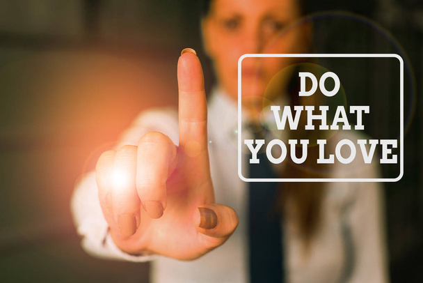 Conceptual hand writing showing Do What You Love. Business photo showcasing Make enjoyable things do activities with motivation Woman in the background pointing with finger in empty space. - Photo, Image
