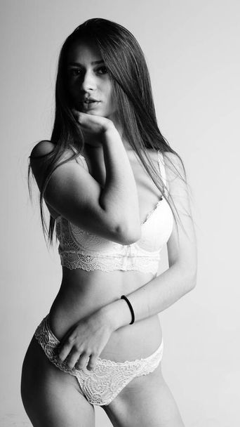 Girl in lingerie on white background - Fotó, kép
