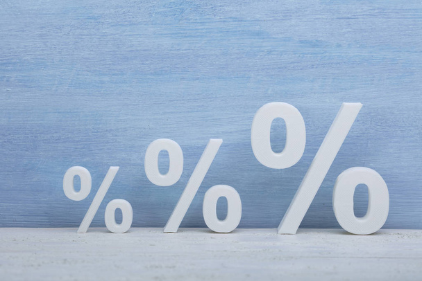 Close-up Of Increasing Size Of Blue Percentage Symbols In A Row - Fotó, kép