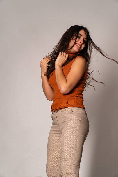 Beautiful brunette model posing in dark room  - Fotografie, Obrázek