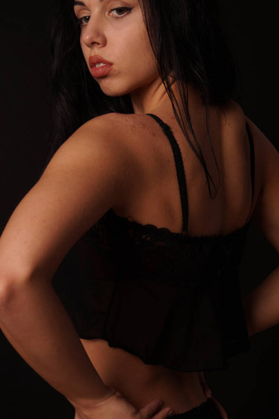 Young beautiful brunette woman in fashionable linen posing in studio  - Fotografie, Obrázek
