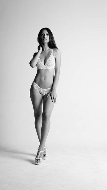 Girl in lingerie on white background - Φωτογραφία, εικόνα