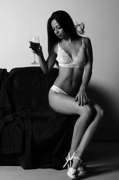 portrait of sweet lovely exquisite charming glamorous girl in lingerie posing on sofa  - Zdjęcie, obraz