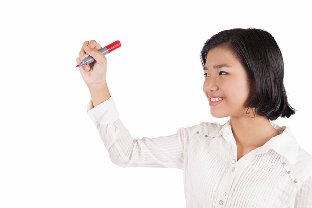 Young Asian businesswoman drawing with a marker - Фото, изображение