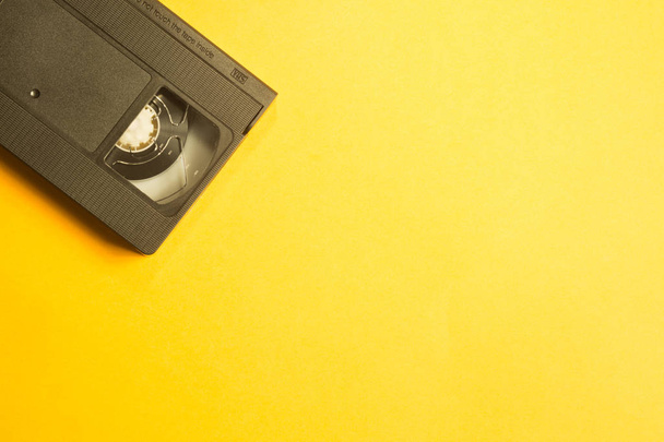 Video cassette isolated on yellow background. vhs with copy space - Fotoğraf, Görsel