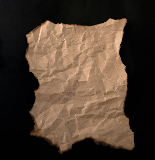 burnt paper sheet isolated on black background - Foto, Imagem