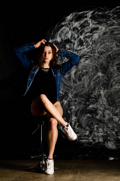 beautiful young woman posing on dark background  - Fotografie, Obrázek