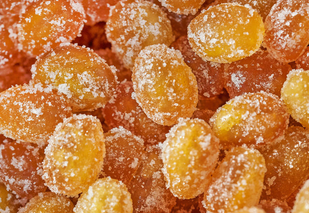Dried dwarf tangerines sprinkled in sugar - Foto, imagen