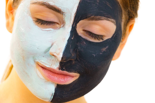 Girl with black white mud mask on face - Foto, Bild