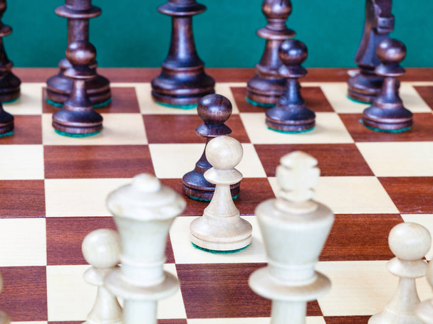 view from white side of chess pawns in the middle of chessboard - 写真・画像