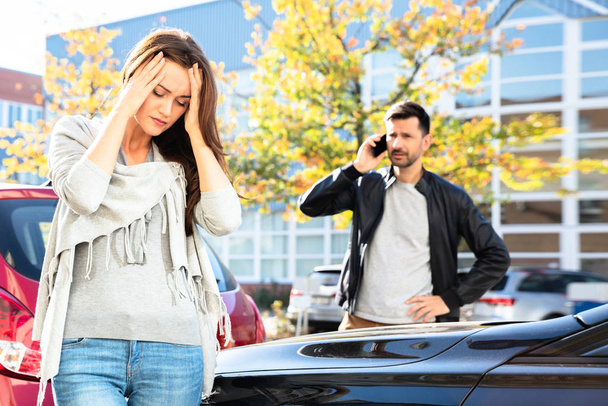 Man Calling For Assistance In Front Of Sad Woman Looking Damaged Car On Road - Photo, Image