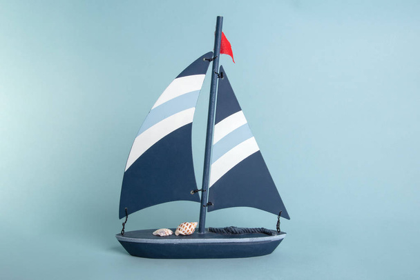 Wooden toy Boat on bright blue Background - Foto, immagini