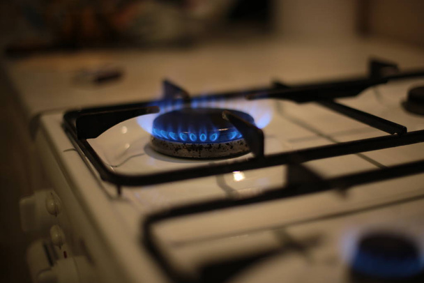 round burning gas burner, kitchen stove fire for cooking - Fotoğraf, Görsel