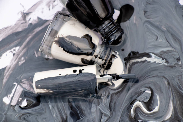 black and white mixed nail polishes on white background - Photo, Image
