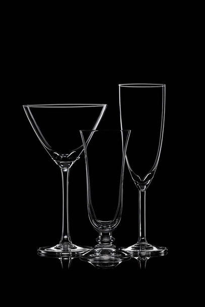 Empty cocktail glassware on a black background. - Foto, Imagen
