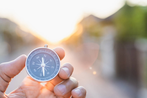 man holding compass on blurred background. for activity lifestyl - Photo, Image