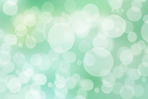 Green turquoise abstract shiny blurred background texture with circular bokeh lights. Beautiful backdrop. - 写真・画像