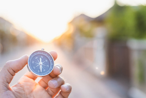 man holding compass on blurred background. for activity lifestyl - 写真・画像