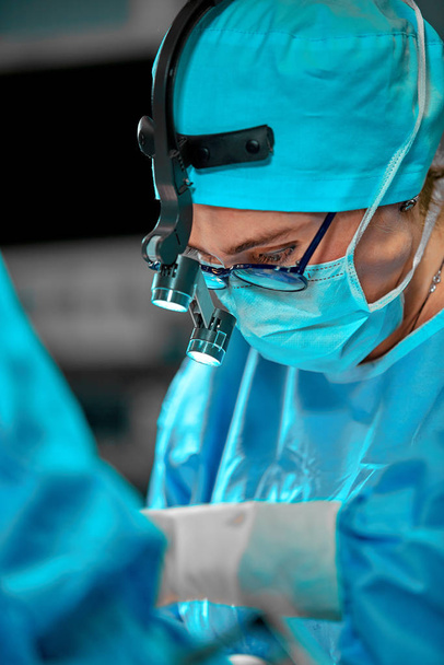 Surgeons team in the operating room, portraits close-up. modern operating, plastic surgery. Beauty industry - Valokuva, kuva