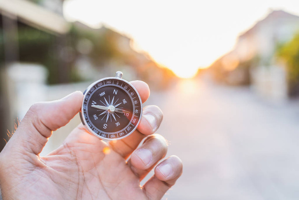 man holding compass on blurred background. for activity lifestyl - Φωτογραφία, εικόνα
