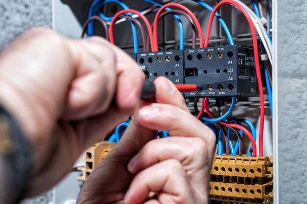 Electrician working on a residential electrical panel. Electrici - Photo, Image