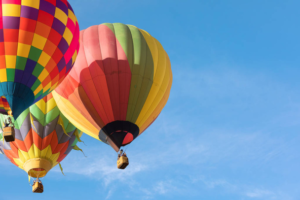 Multi colored hot air balloons on blue sky - Photo, Image